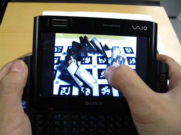 Goblin XNA Domino Knockdown running on a Sony UMPC. The user has just fired a ball at a collection of falling dominoes.